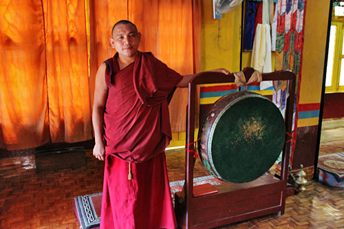 Pokhara-Shree-Gaden-Dhargay Ling Monastery10 Monk shows me one of the larger drums
