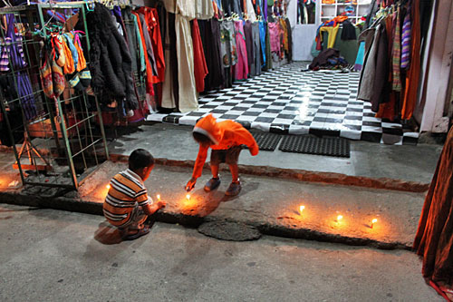 Pokhara-Tihar-Store-Candles Candles burn on the stoops of stores and homes during Tihar, also known as the Festival of Lights