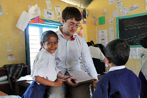 Annapurna-School-Teacher2 Volunteer Michael Anfield reviews homework