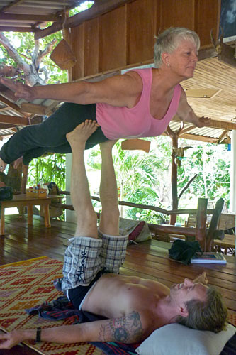 Koh-Pha-Ngan-AcroYoga1 Richard Baimbridge "flying" me in "Front Bird" pose. Photo courtesy of Susan Huang.