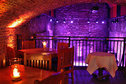 The-Caves A restored cavern at The Caves, a bar carved out of the ancient vaults and passageways discovered beneath the Old City in Edinburgh, Scotland