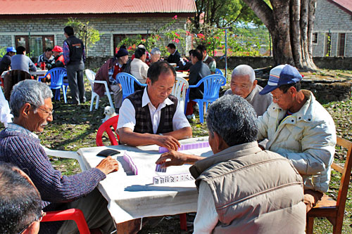 Pokhara-Tashiling-Tibetan-Refugee-Settlement-Human-Rights-Day11 Men play dominos during International Human Rights Day Celebration at Tashilng Tibetan refugee settlement in Pokhara, Nepal