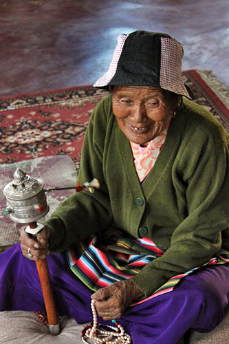 Pokhara-Tashiling-Tibetan-Refugee-Settlement-Human-Rights-Day5 Spinning prayer wheel at International Human Rights Day Celebration at Tashiling Tibetan refugee settlement in Pokhara, Nepal