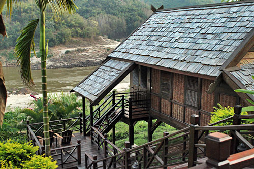 LuangSayCruise-Lodge5 Individual teak and palm thatch cottage at Luang Say Lodge in Pakbeng, our overnight accommodations on the Luang Say Cruise