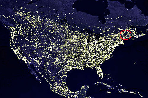 usa-at-night-satellite Night satellite image of the US, showing the dark area of Adirondack Park circled in red. Image courtesy of NASA/GSFC/Craig Mayhew and Robert Simmon